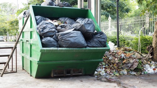 Professional team disposing furniture in Islington